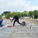 Estudiantes de Ingeniería Colaboran en la Pintura de Parqueos de la Biblioteca Profesor Juan Bosch